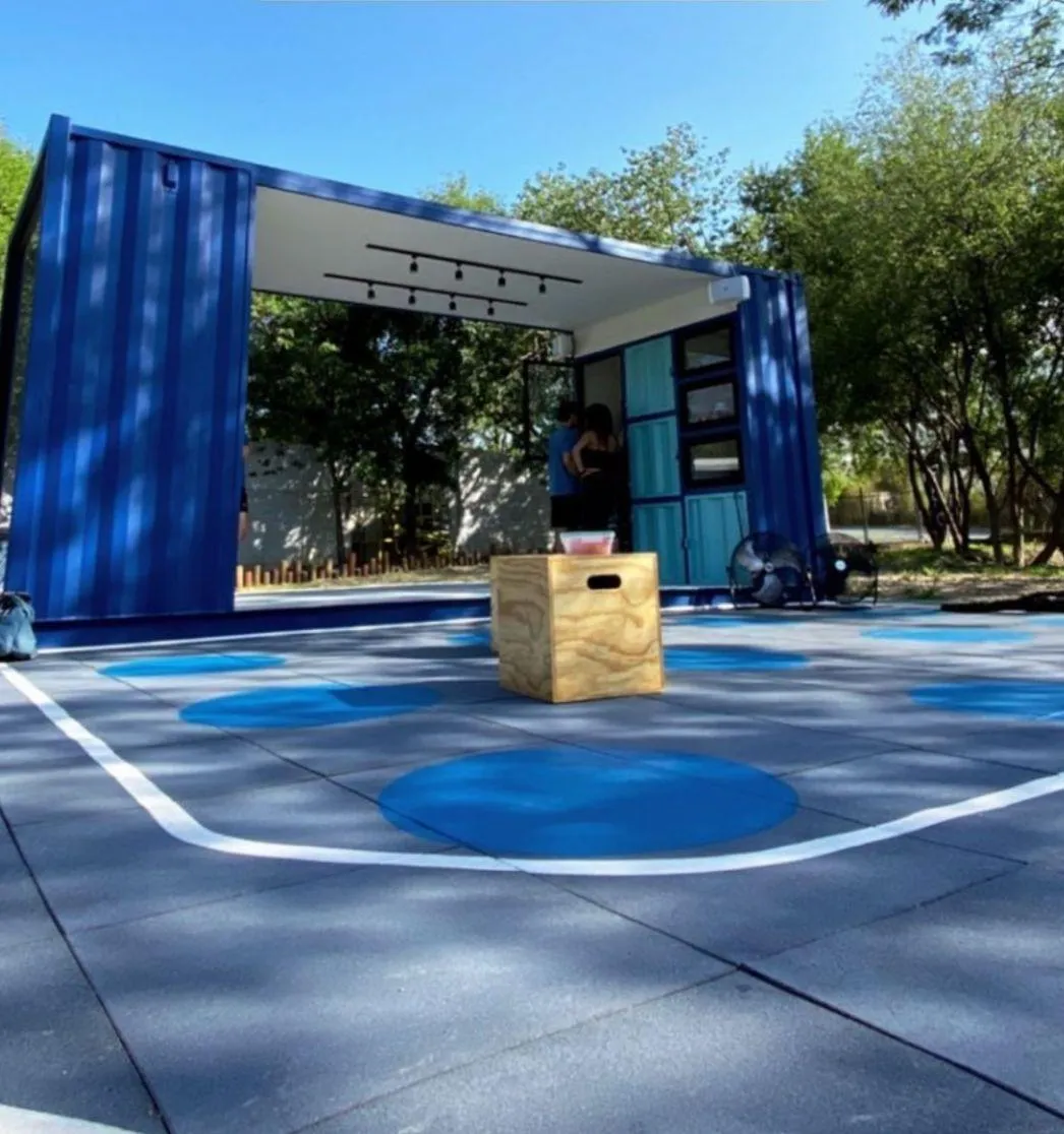 Outdoor functional training area with gray rubber tile and blue circles