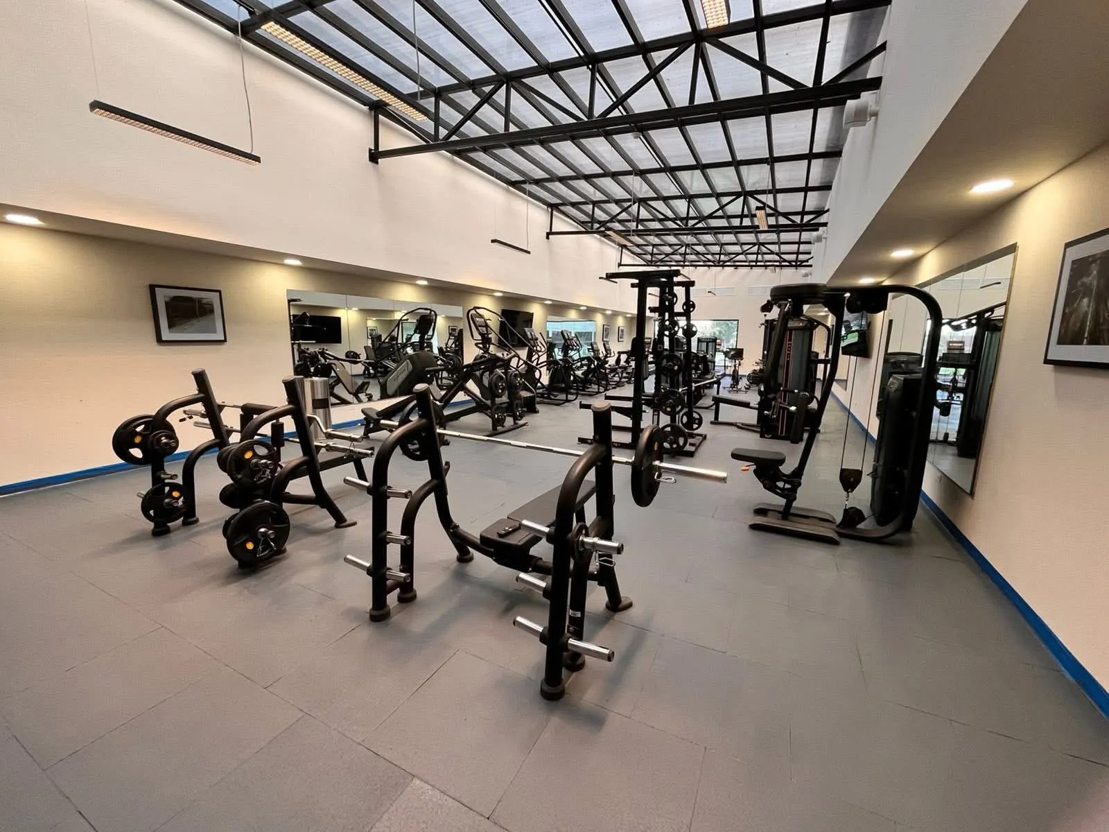 Full gym with rubber flooring installed wall to wall