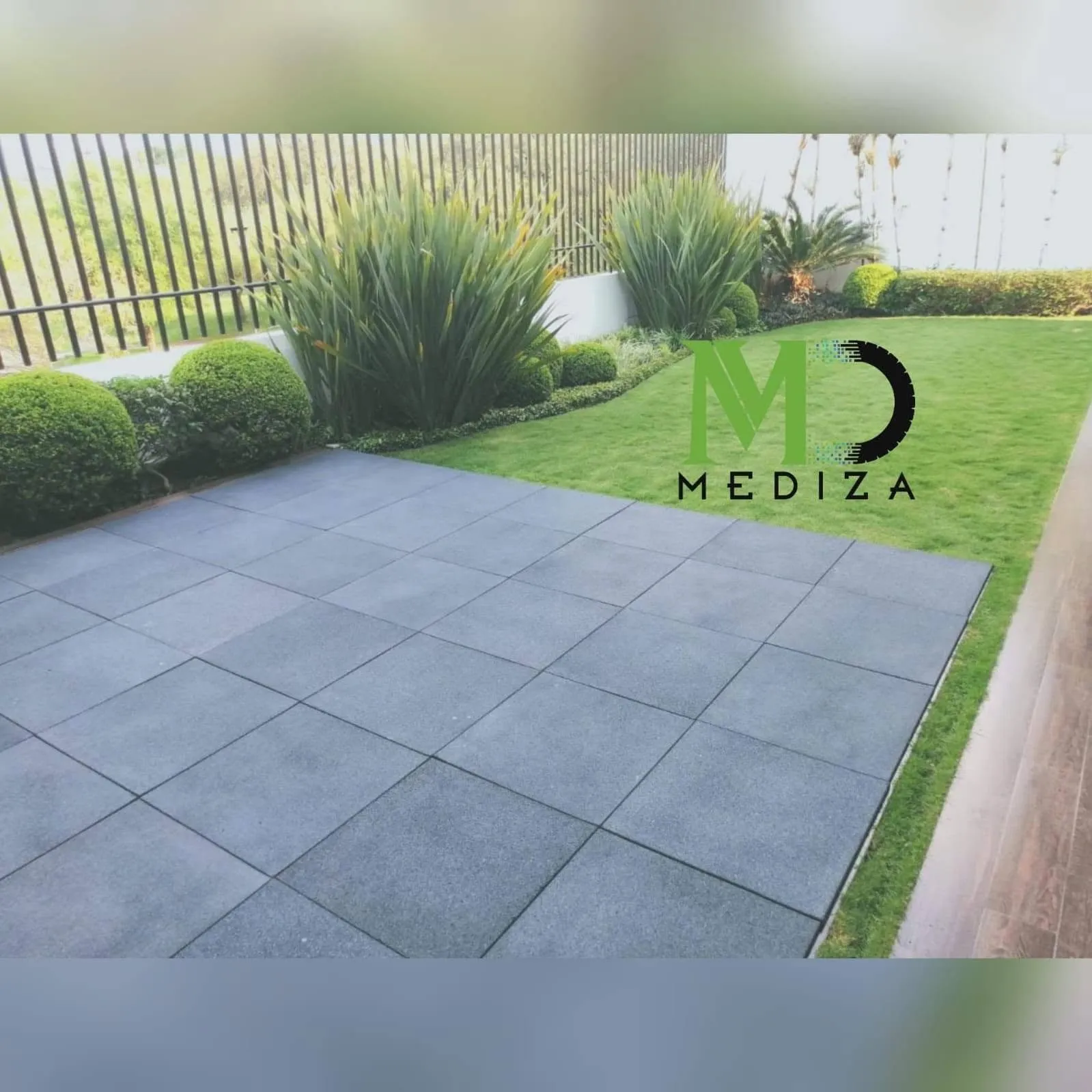 Residential terrace with newly installed grey rubber tile